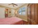 Comfortable bedroom offering hardwood floors, closet and natural light, creating a relaxing retreat at 8832 Enclave Ct, Sarasota, FL 34238