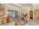 Bright living room showcasing tray ceilings and an open floor plan at 8832 Enclave Ct, Sarasota, FL 34238