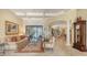 Spacious living room with views of the outdoor pool area at 8832 Enclave Ct, Sarasota, FL 34238