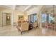 Inviting living room featuring coffered ceilings and tile floors at 8832 Enclave Ct, Sarasota, FL 34238