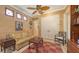 Cozy office space with a comfortable sofa, leather ottoman, and ample natural light at 8832 Enclave Ct, Sarasota, FL 34238