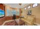 Bright office with a large desk, comfortable seating, and a view of the outdoors at 8832 Enclave Ct, Sarasota, FL 34238