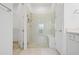 Elegant bathroom with a glass-enclosed shower, tiled walls, and a built-in bench seat at 9566 Coastline Way, Parrish, FL 34219