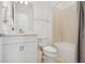 Clean bathroom with white vanity, toilet, and tiled shower/tub combo at 9566 Coastline Way, Parrish, FL 34219