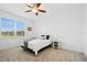 Comfortable bedroom featuring carpeted floors, a window with natural light, and simple yet tasteful decor at 9566 Coastline Way, Parrish, FL 34219