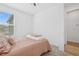 Bright bedroom featuring a window and neutral colors, creating a peaceful retreat at 9566 Coastline Way, Parrish, FL 34219