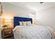 Comfortable bedroom with an upholstered headboard, wood nightstands and decorative pillows at 1008 37Th W St, Bradenton, FL 34205
