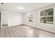 Bright bedroom featuring hardwood floors and two windows offering lots of natural light at 1008 37Th W St, Bradenton, FL 34205