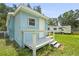 Charming blue cottage featuring a small porch and white trim at 1008 37Th W St, Bradenton, FL 34205