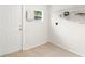 The laundry room features a storage shelf and a window for natural light at 1008 37Th W St, Bradenton, FL 34205