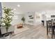 Bright, open-concept living space with modern flooring, neutral tones, and seamless flow to kitchen at 1008 37Th W St, Bradenton, FL 34205