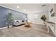 Comfortable living room featuring modern decor, light gray walls, hardwood floors, and abundant natural light at 1008 37Th W St, Bradenton, FL 34205
