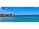 Scenic aerial view of the city skyline and waterfront with clear blue skies and turquoise water at 1076 Toc0Baga, Sarasota, FL 34234