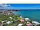 Breathtaking aerial shot showcasing the property amidst lush greenery, waterfront access, and city views at 1076 Toc0Baga, Sarasota, FL 34234
