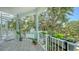 Balcony with plants in planters and partial stairwell at 1076 Toc0Baga, Sarasota, FL 34234