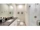 Chic bathroom with a glass-enclosed shower, modern vanity, and neutral decor accents at 1076 Toc0Baga, Sarasota, FL 34234