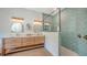 Modern bathroom with double vanity, stylish mirrors, and a frameless glass shower at 1076 Toc0Baga, Sarasota, FL 34234