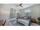 Bedroom with blue accents, wood floors, and a ceiling fan at 1076 Toc0Baga, Sarasota, FL 34234