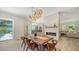 Modern dining room featuring a fireplace, and an open floor plan at 1076 Toc0Baga, Sarasota, FL 34234