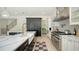 Modern kitchen featuring stainless appliances, a center island, and a farmhouse sink at 1076 Toc0Baga, Sarasota, FL 34234