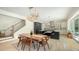 Modern eat-in kitchen featuring stainless appliances, cabinetry, island, and staircase at 1076 Toc0Baga, Sarasota, FL 34234