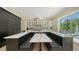 Contemporary eat-in kitchen featuring marble island countertops with bar seating at 1076 Toc0Baga, Sarasota, FL 34234