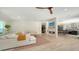 Open-concept living room with a modern fireplace, and kitchen access, perfect for entertaining at 1076 Toc0Baga, Sarasota, FL 34234