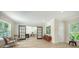 Bright living room with rocking chairs, sliding barn doors, and decor at 1076 Toc0Baga, Sarasota, FL 34234