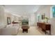 Open-concept living room with fireplace and access to the bedroom at 1076 Toc0Baga, Sarasota, FL 34234