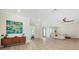 A stylish living room featuring a modern furniture, tiled floors and a large window at 1076 Toc0Baga, Sarasota, FL 34234