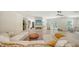 Bright living room with modern fireplace, light tiled floors and comfortable seating at 1076 Toc0Baga, Sarasota, FL 34234