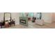 Cozy living area featuring a modern fireplace and comfortable seating, with a view into the hallway at 1076 Toc0Baga, Sarasota, FL 34234
