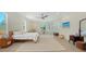 Bright and airy main bedroom featuring a ceiling fan, balcony access, and neutral decor at 1076 Toc0Baga, Sarasota, FL 34234