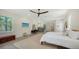 Spacious main bedroom with a stylish fireplace, wood floors, and access to a balcony at 1076 Toc0Baga, Sarasota, FL 34234