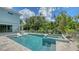 Backyard and private pool area, fenced in and bordered by lush tropical plants and privacy trees at 1076 Toc0Baga, Sarasota, FL 34234