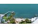 Breathtaking waterfront with private dock, palm trees, and clear turquoise water views at 1076 Toc0Baga, Sarasota, FL 34234