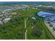 Panoramic aerial view of the community showcasing lush landscaping, walking paths, ponds, and neighborhood homes at 11422 Apple Tree Cir, Bradenton, FL 34211