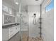 Modern bathroom featuring a frameless glass shower and a sleek vanity with a gray countertop at 11422 Apple Tree Cir, Bradenton, FL 34211