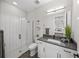 Bright, modern bathroom with glass-enclosed shower, white subway tile, and sleek vanity at 11422 Apple Tree Cir, Bradenton, FL 34211