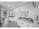 Bathroom featuring dual vanity with modern fixtures and beautiful lighting at 11422 Apple Tree Cir, Bradenton, FL 34211