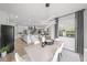 Open dining area features modern lighting and seamless flow to the living and kitchen spaces at 11422 Apple Tree Cir, Bradenton, FL 34211