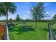 Community dog park with secure fencing, benches, and green space for pets to play and socialize at 11422 Apple Tree Cir, Bradenton, FL 34211