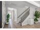 Inviting foyer with wood floors, staircase, recessed lighting, and views of the front door at 11422 Apple Tree Cir, Bradenton, FL 34211