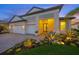 Charming single Gathering home featuring a two-car garage and beautifully landscaped front yard at 11422 Apple Tree Cir, Bradenton, FL 34211