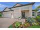 Beautiful single Gathering home with a two-car garage and inviting front landscaping at 11422 Apple Tree Cir, Bradenton, FL 34211