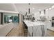 Spacious kitchen with a large island, pendant lighting, and a seamless transition to the living area at 11422 Apple Tree Cir, Bradenton, FL 34211