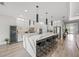 Modern kitchen with a large island, pendant lighting, and stainless steel appliances at 11422 Apple Tree Cir, Bradenton, FL 34211