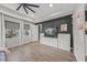 This main bedroom has hardwood floors, large windows, a TV, and ample storage space at 11422 Apple Tree Cir, Bradenton, FL 34211