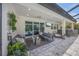 Screened patio with comfortable seating, outdoor bar, and a view of the sparkling pool at 11422 Apple Tree Cir, Bradenton, FL 34211