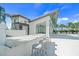 Modern community pool clubhouse featuring bar seating, sleek design, and a pristine pool area at 11422 Apple Tree Cir, Bradenton, FL 34211